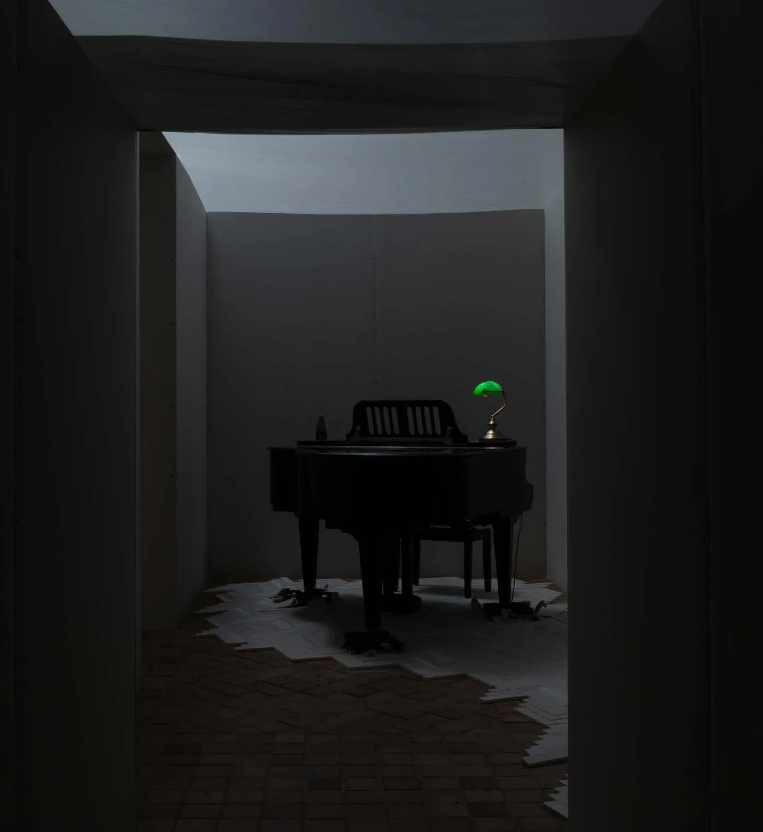 part of the Leaving Room installation - a practice room: walls and parquet floor made of drywall, painter's foil, banker's lamp, Wittner Tak